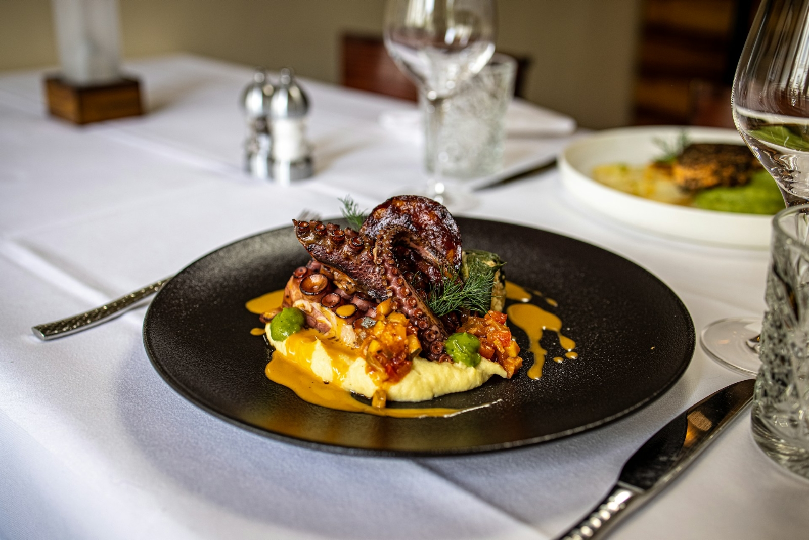 Before the First Bite: The Art of The Bespoke Menu 56 Charred octopus and potato puree