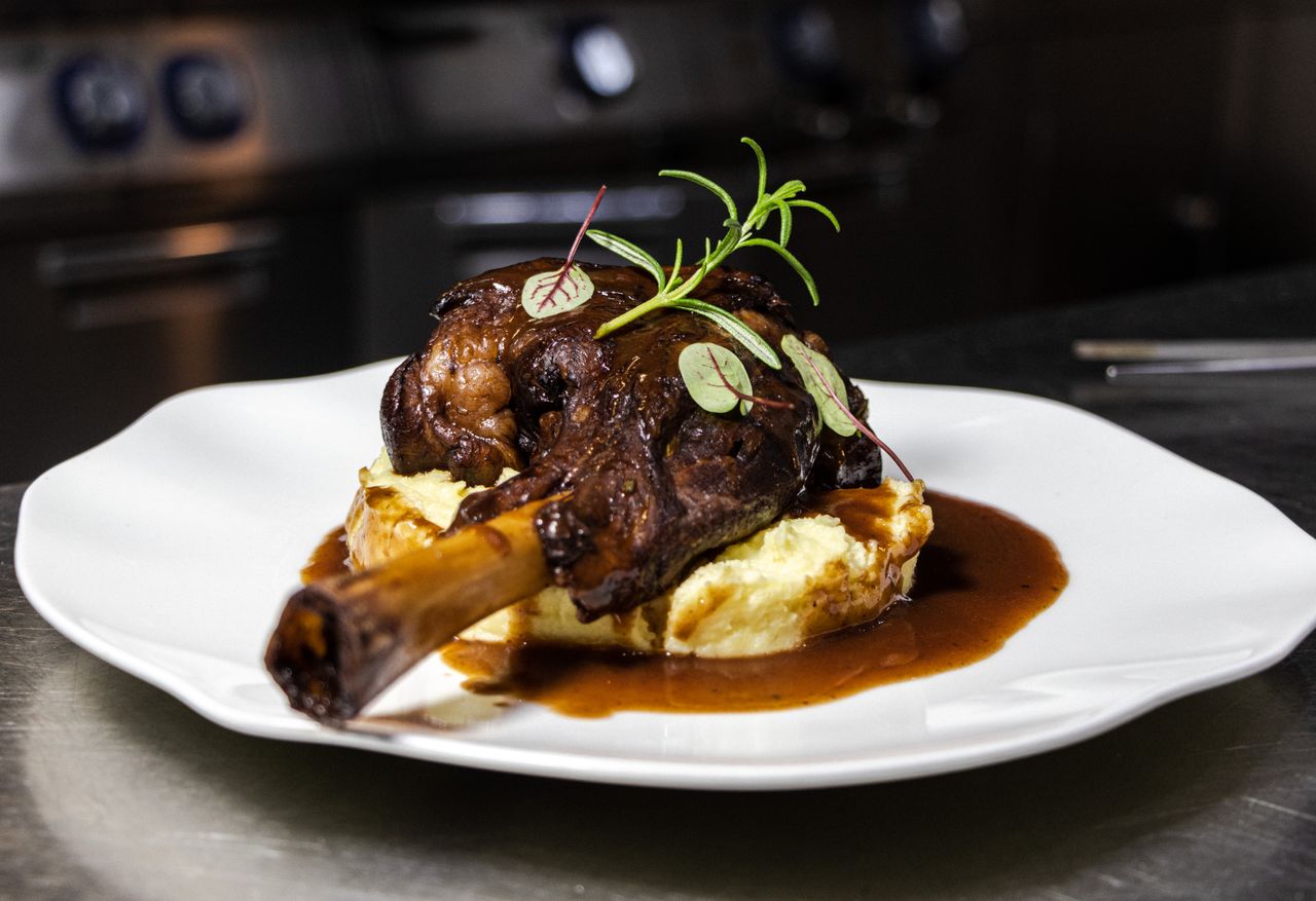 Why Everyone Is Throwing a Julia Child Inspired Dinner Party (And How You Can Too) 107 julia child roasted lamb shanks served on creamy mashed potatoes